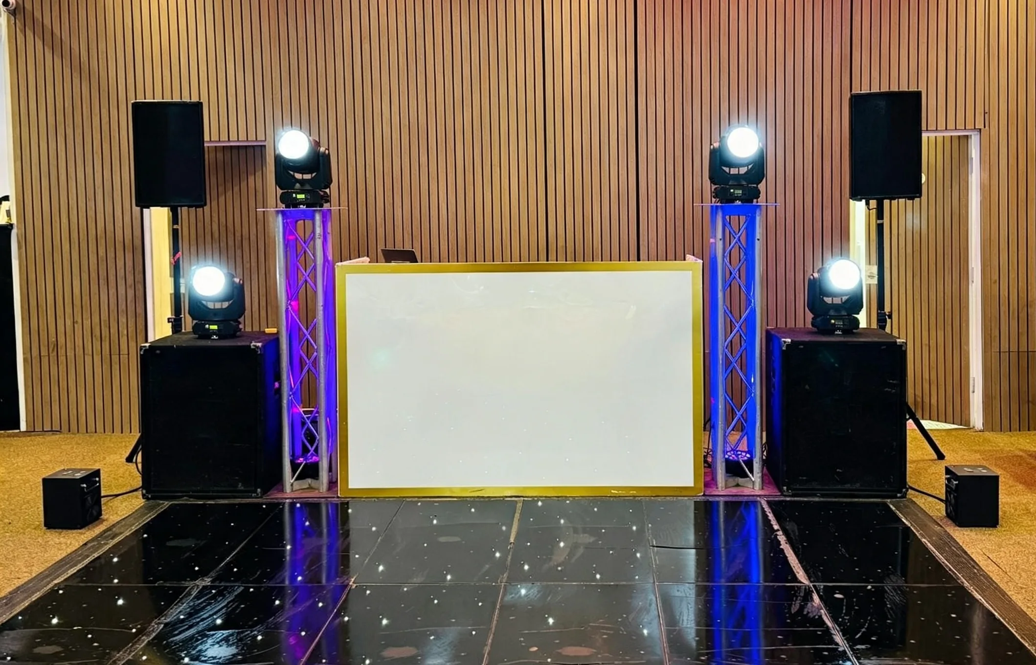 Premium DJ booth, speakers and professional moving-head lighting